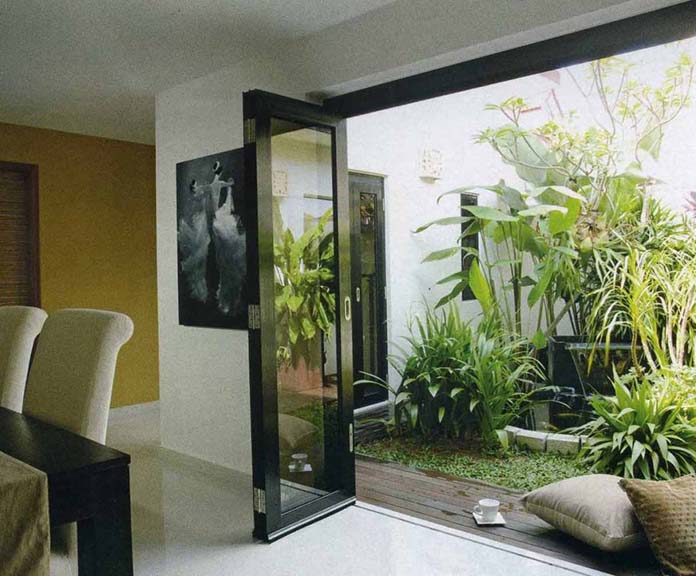 Ảnh 12: Không gian phía sau được thiết kế với tiểu cảnh của mẫu nhà cấp 4 6 ×15m có gác lửng