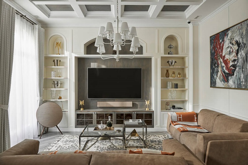  Không gian phòng khách của căn biệt thự mang đậm phong cách Mỹ, với điểm nhấn là bộ sofa da lộn