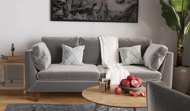 
Sofa nỉ màu ghi đậm trở thành điểm nhấn ấn tượng cho không gian phòng khách
